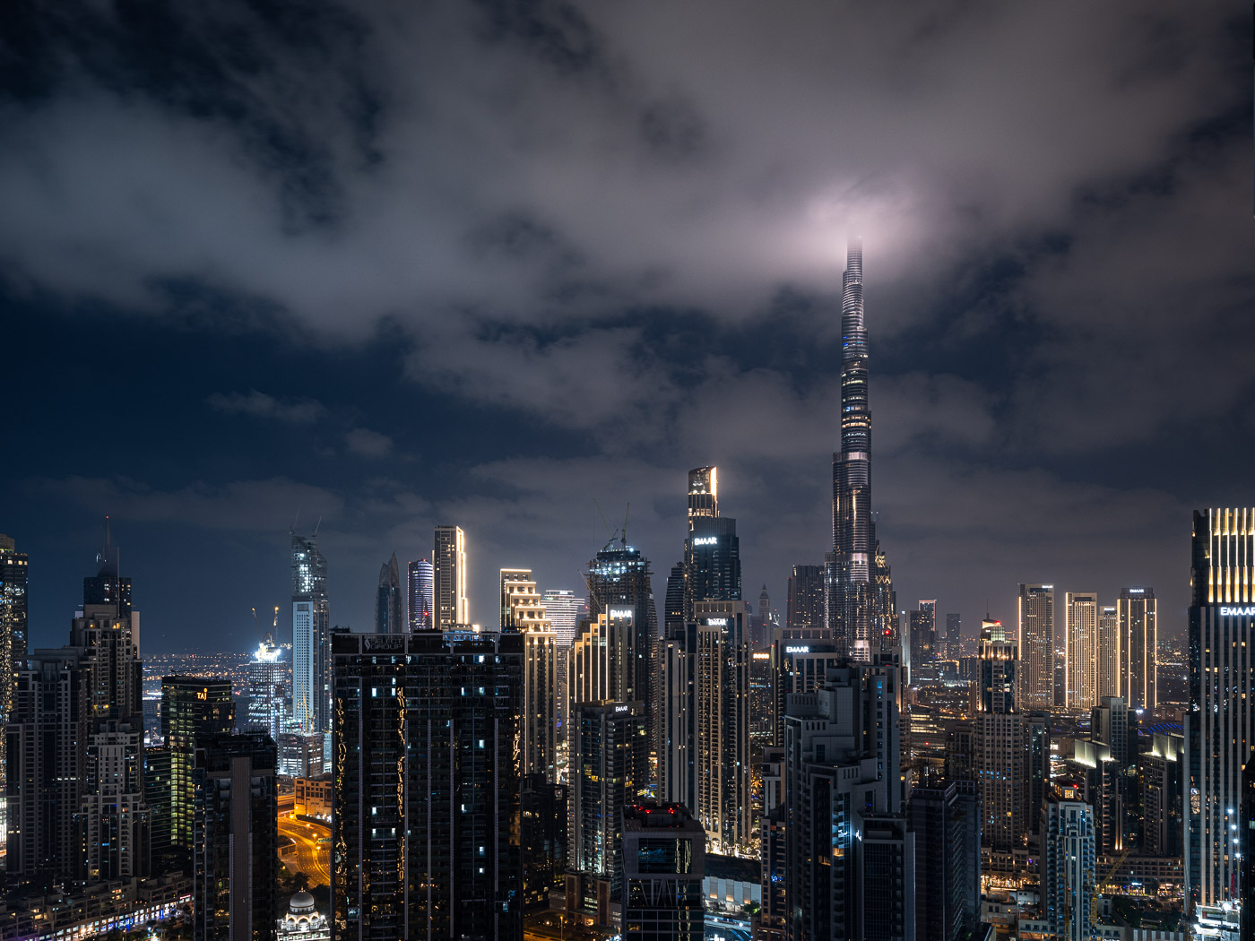 Burj Khalifa in Dubai with the top covered in clouds